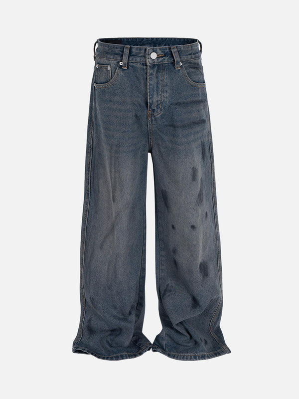 Front view of TALISHKO's blue baggy jeans with ink splash design, perfect for urban style.