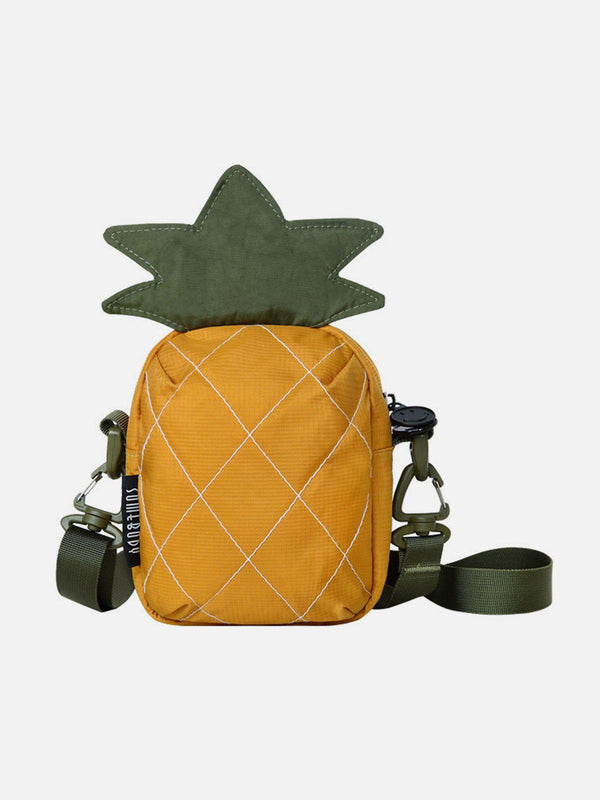 Front view of a yellow pineapple-shaped bag with green accents by TALISHKO, ideal for casual outings.