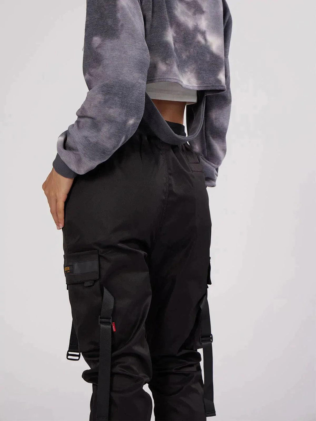 Back view of TALISHKO tactical utility joggers, showcasing detailed straps and pocket accents.