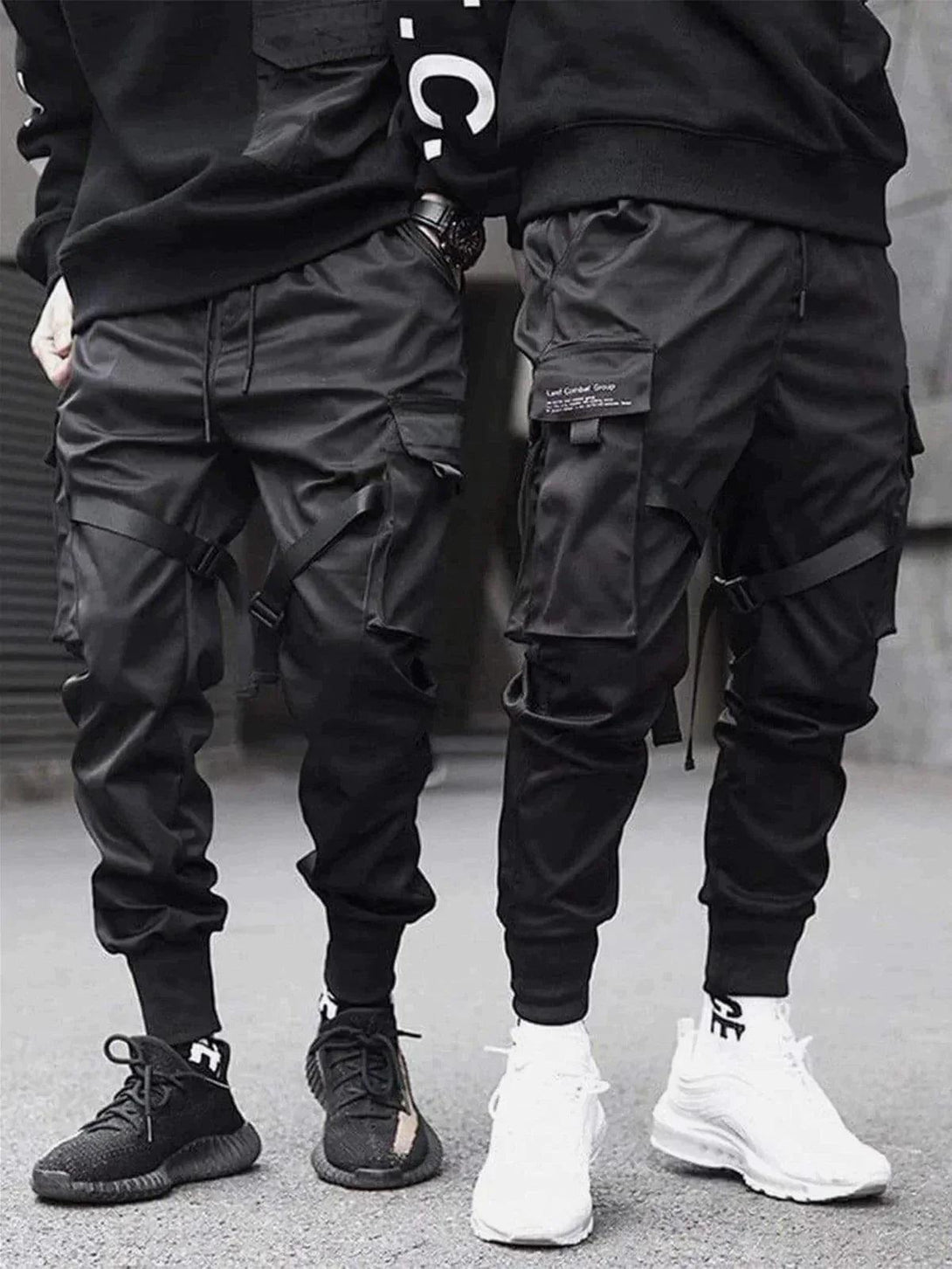 TALISHKO tactical joggers styled with bold sneakers, highlighting streetwear flair.