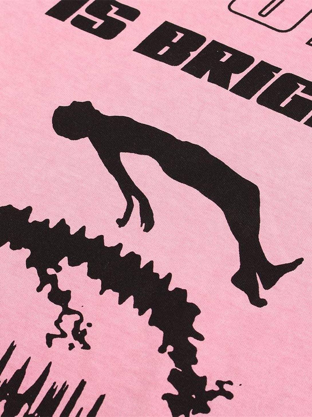 Intricate look at TALISHKO's pink graphic T-shirt, featuring bold black silhouette design.