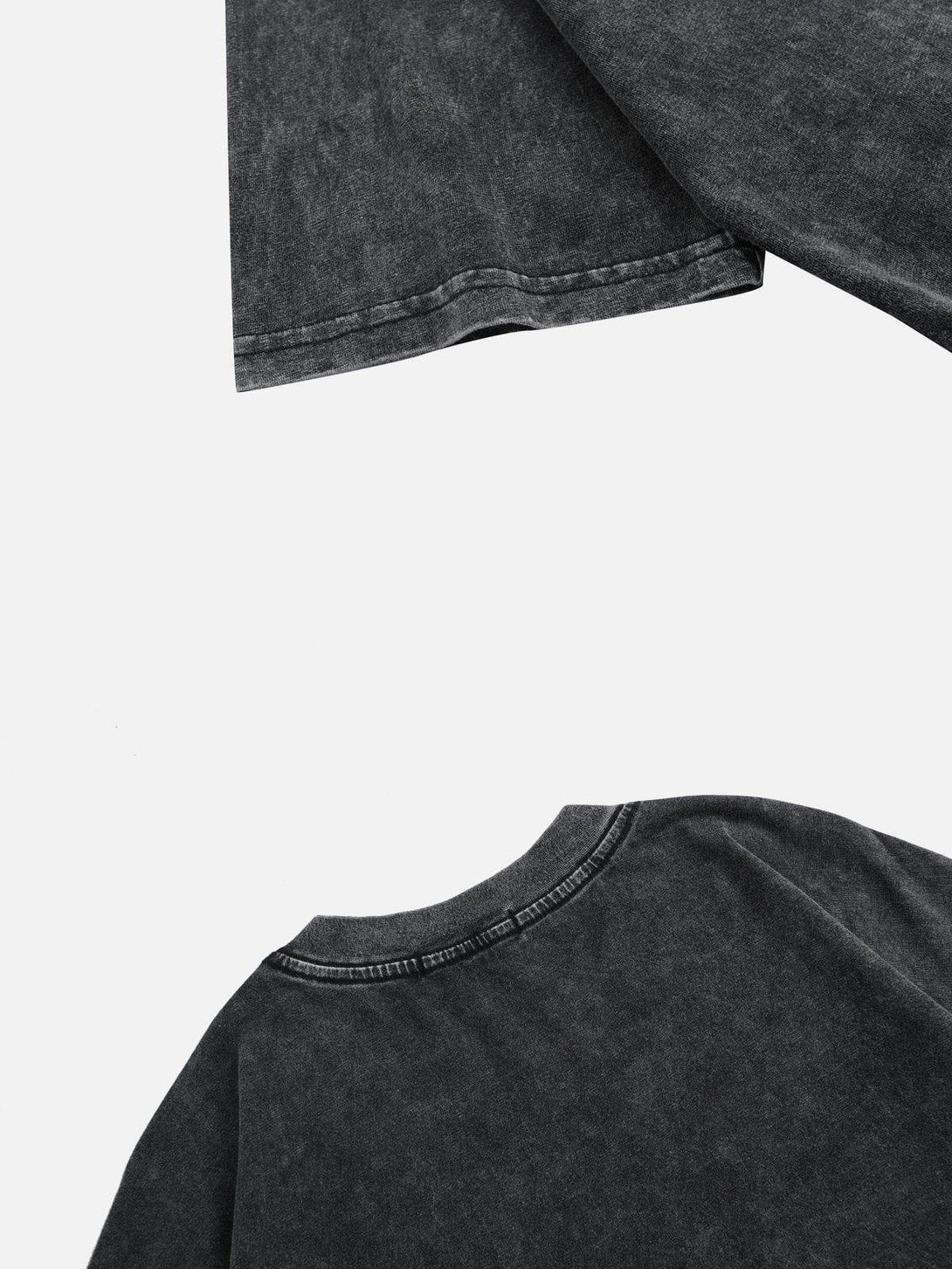 Detailed fabric and stitching of a black tee by TALISHKO, highlighting its casual style.