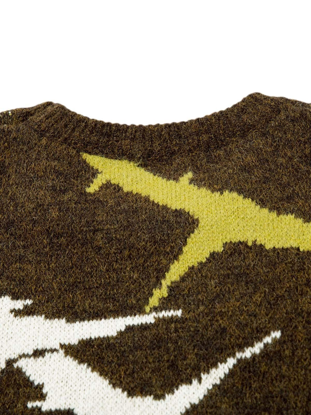 Intricate look at TALISHKO's thorn-patterned sweater, showcasing detailed knit texture.
