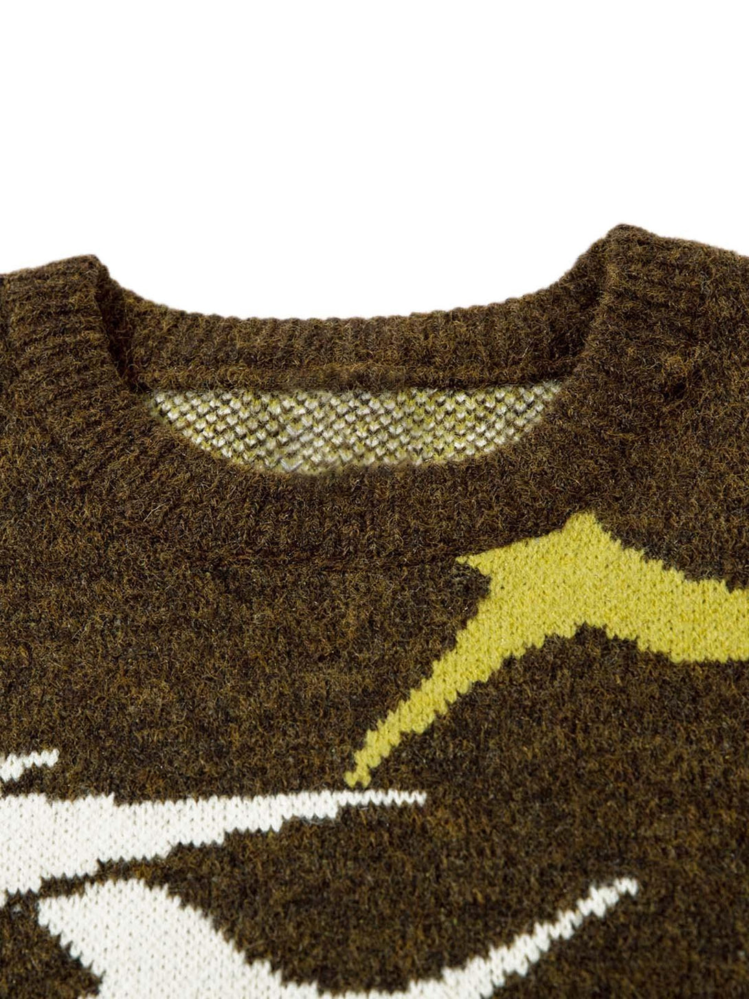 Zoomed-in texture of TALISHKO's thorn-patterned sweater, highlighting intricate knit details.