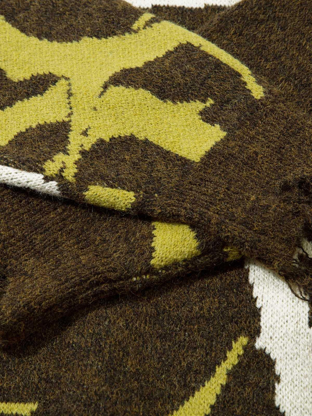 A detailed view of TALISHKO's thorn-patterned sweater, highlighting its unique knit texture.