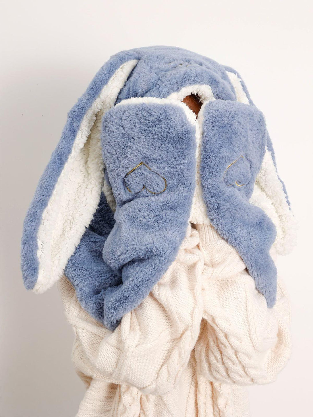 Model wearing a blue three-in-one big ear hat with scarf and gloves by TALISHKO, cozy design.