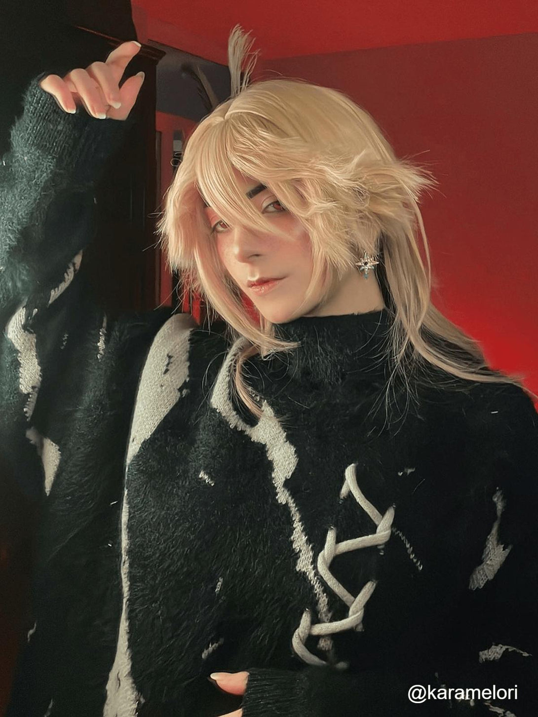 Model in a cozy tie-dye bandage turtleneck sweater by TALISHKO, with distinct lace-up accents.
