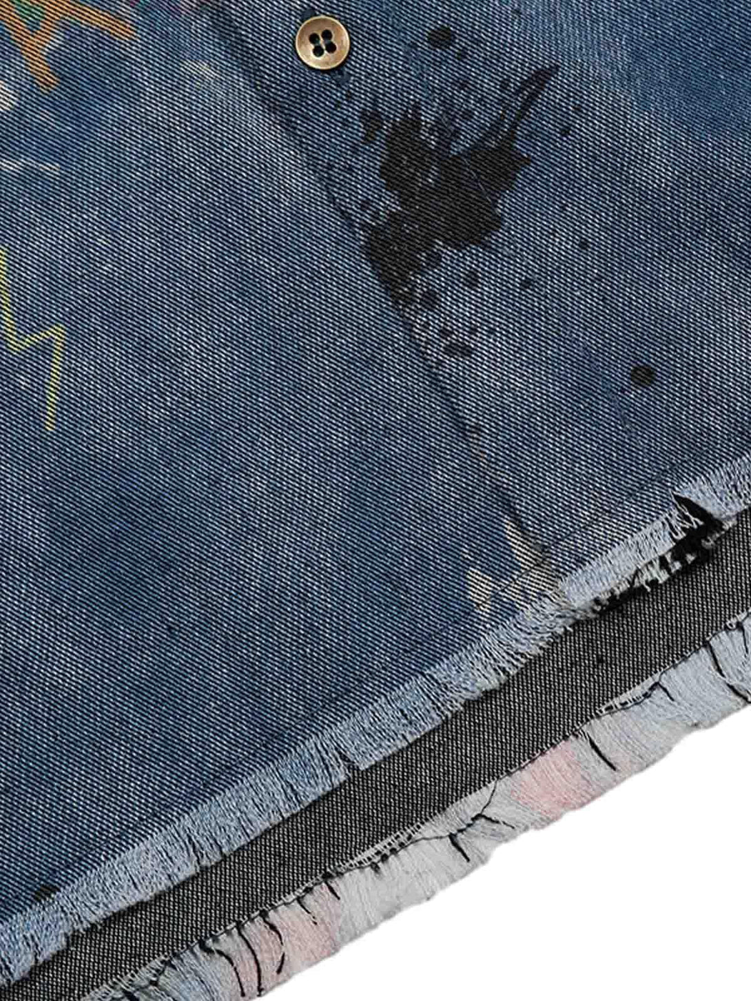 Detailed fabric and stitching on a tie-dye denim graffiti polo by TALISHKO, featuring unique patterns.