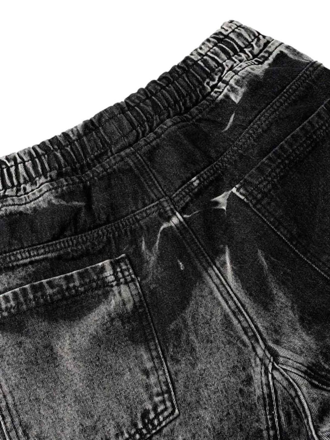 Detailed view of TALISHKO tie-dye cargo jorts, showcasing elastic waistband and pocket design.