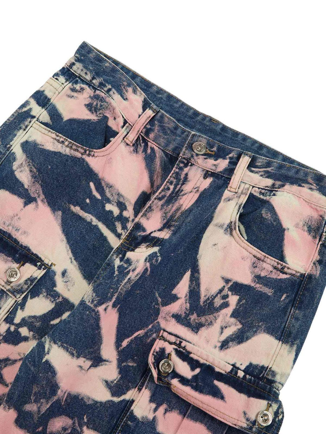 Zoomed-in texture of TALISHKO tie-dye camouflage cargo jeans, showcasing vibrant pink and blue patterns.