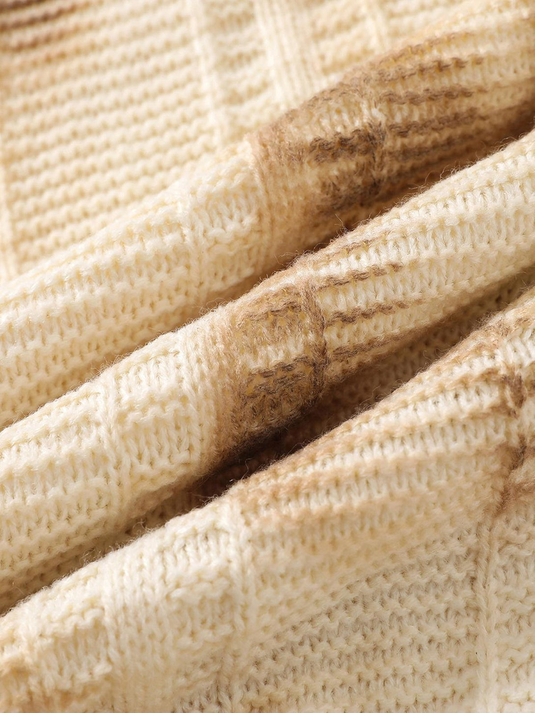 Detailed texture of TALISHKO's tie-dye sweater, showcasing its warm, earthy knit design.