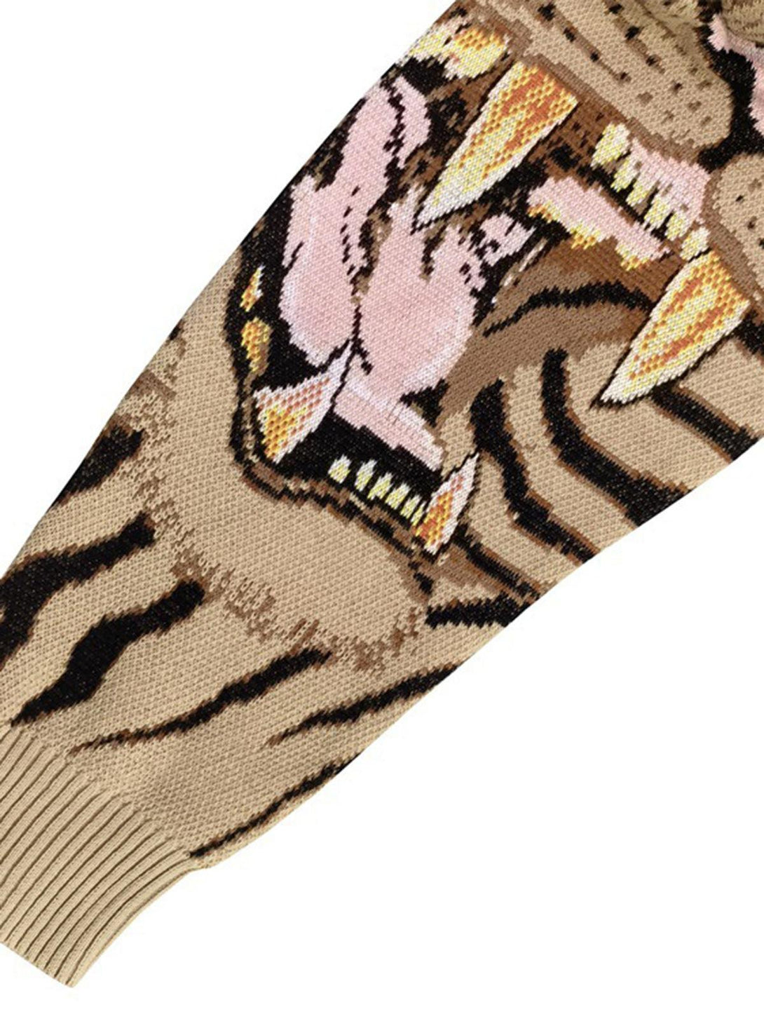 Intricate look at TALISHKO's tiger-knit sweater sleeve, highlighting bold design details.