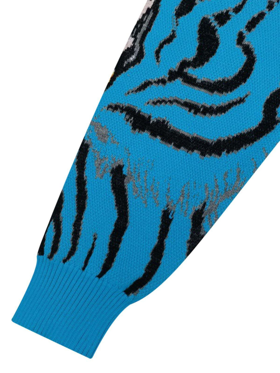 TALISHKO's sweater sleeve features a vibrant blue tiger pattern, showcasing intricate knit details.