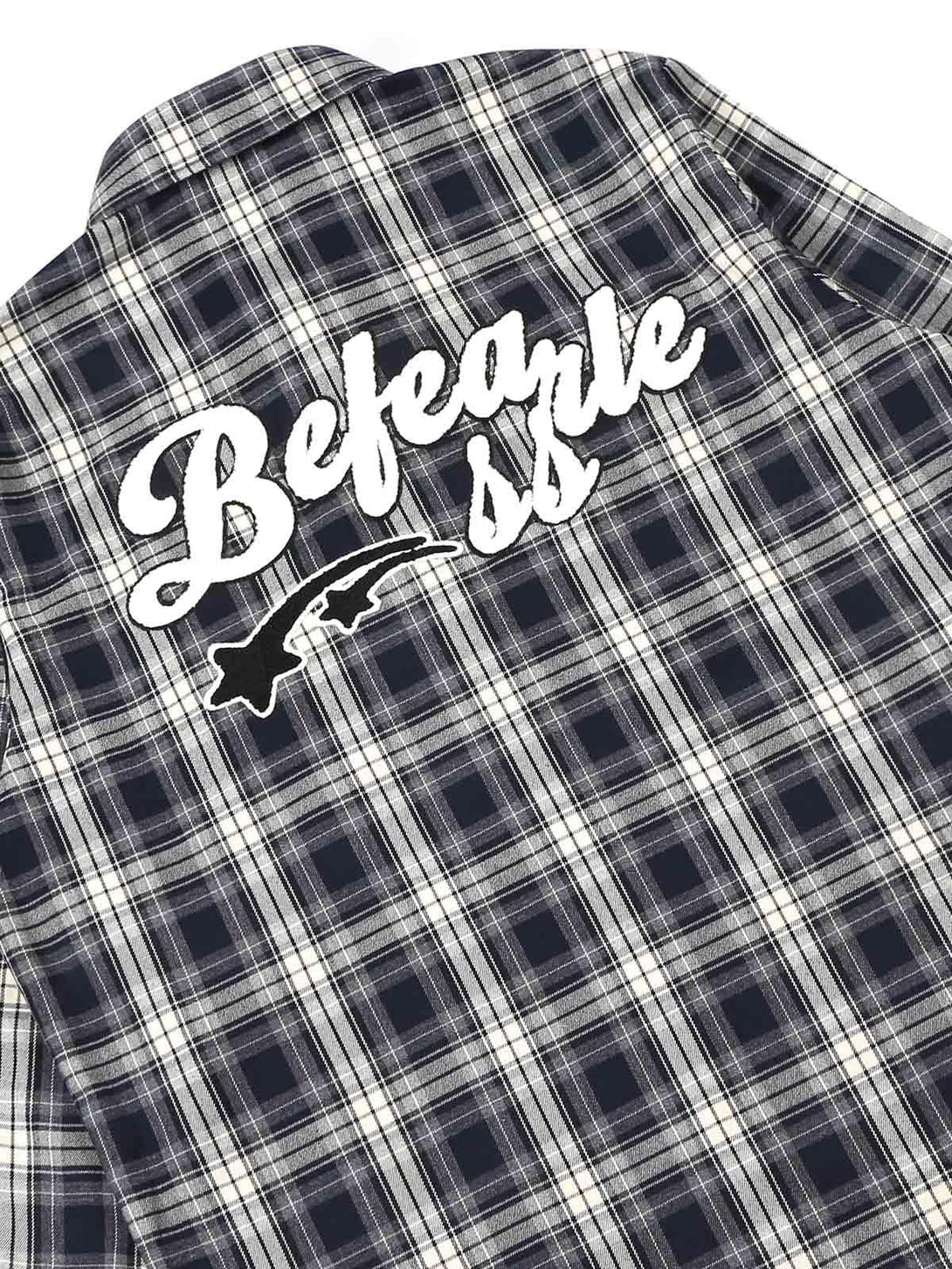 Back view of plaid shirt with bold towel embroidery, designed by TALISHKO for a unique look.