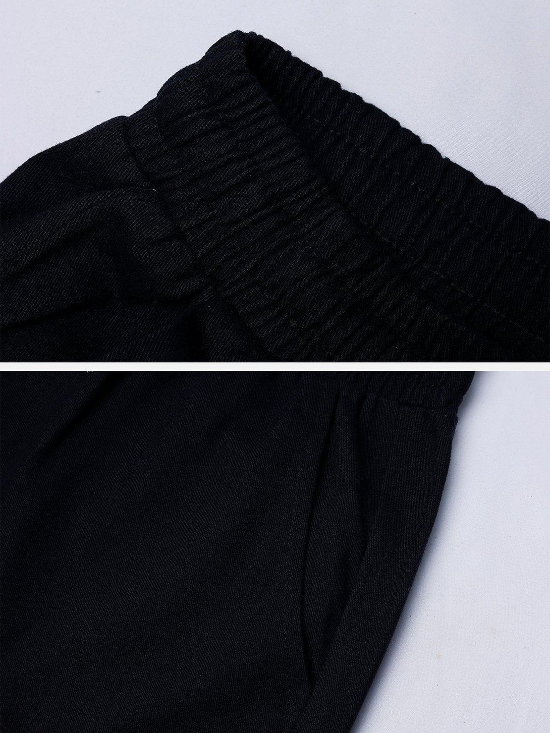 Elastic waistband detail on black straight-leg pants by TALISHKO, showcasing comfort and style.