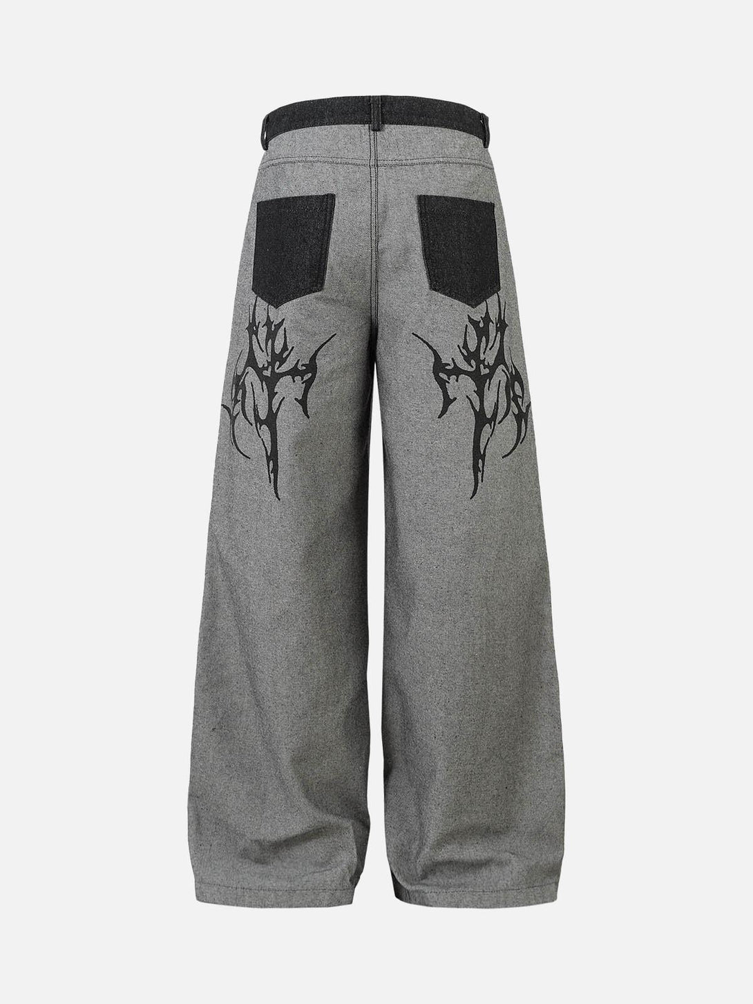 Back view of gray baggy jeans with tribal flame design by TALISHKO, highlighting bold streetwear.