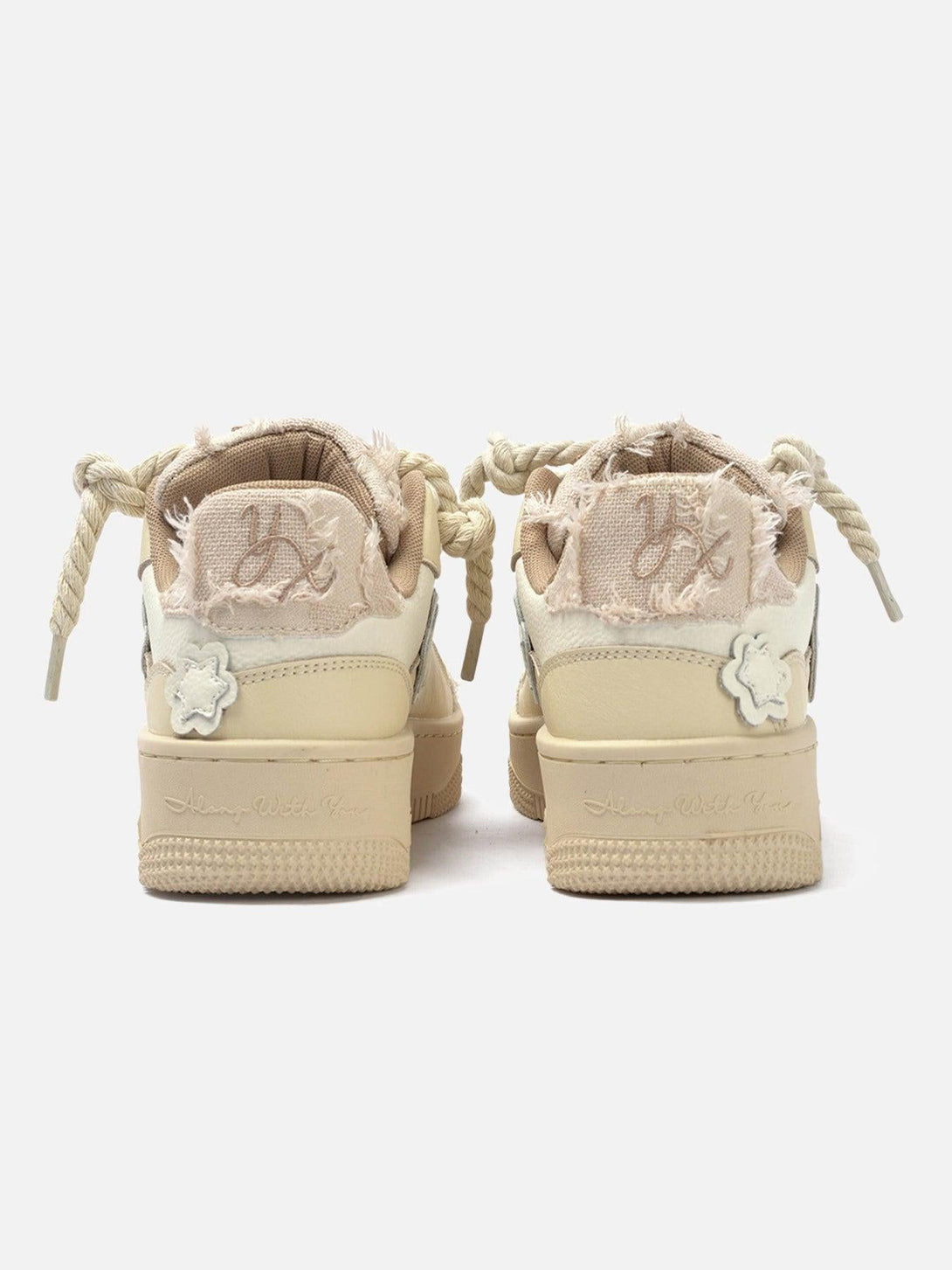 Back view of TALISHKO board shoes with frayed edges and chunky twine laces, showcasing unique style.