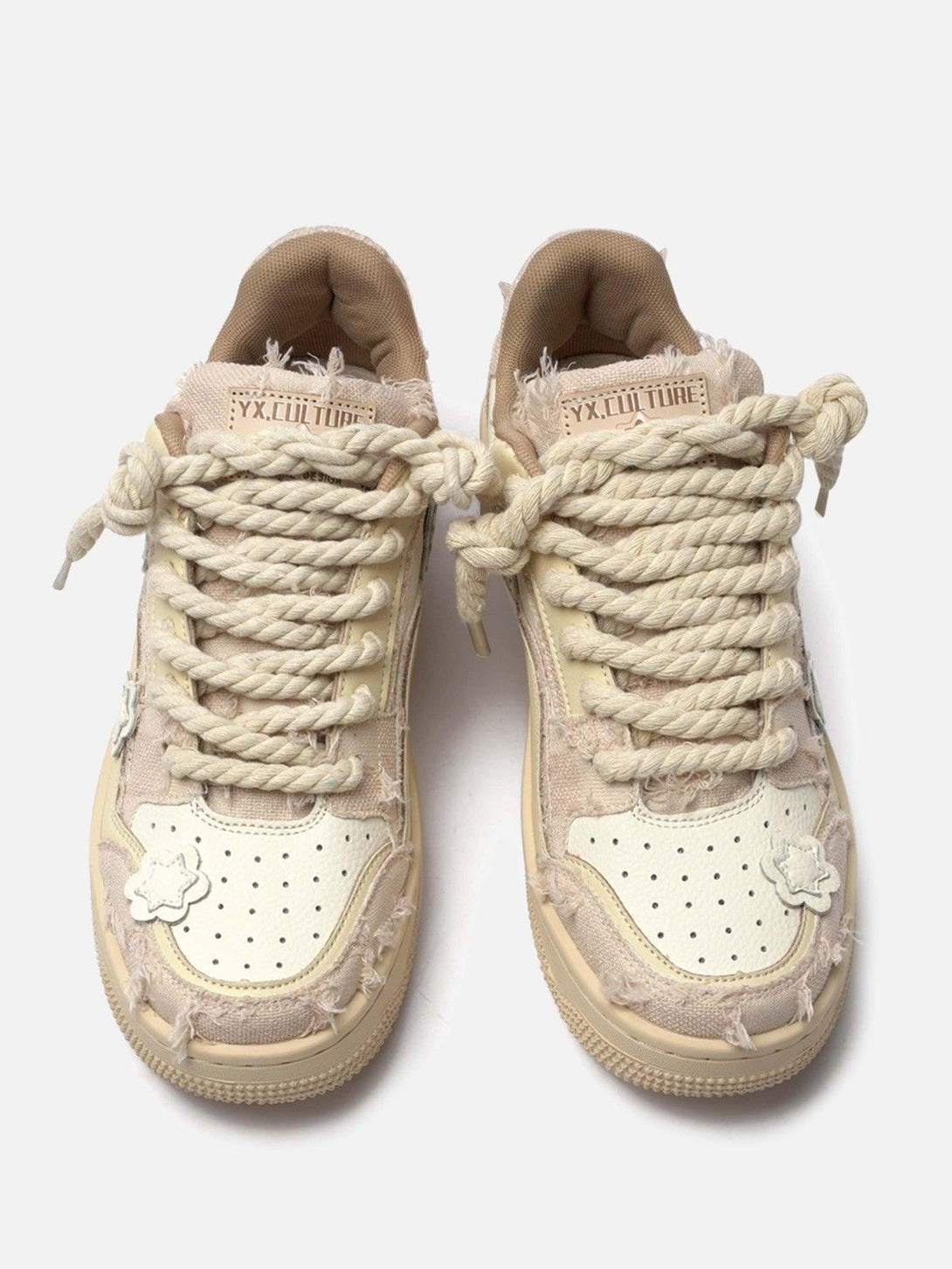 TALISHKO low-top sneakers featuring chunky twine laces and star accents for a trendy look.