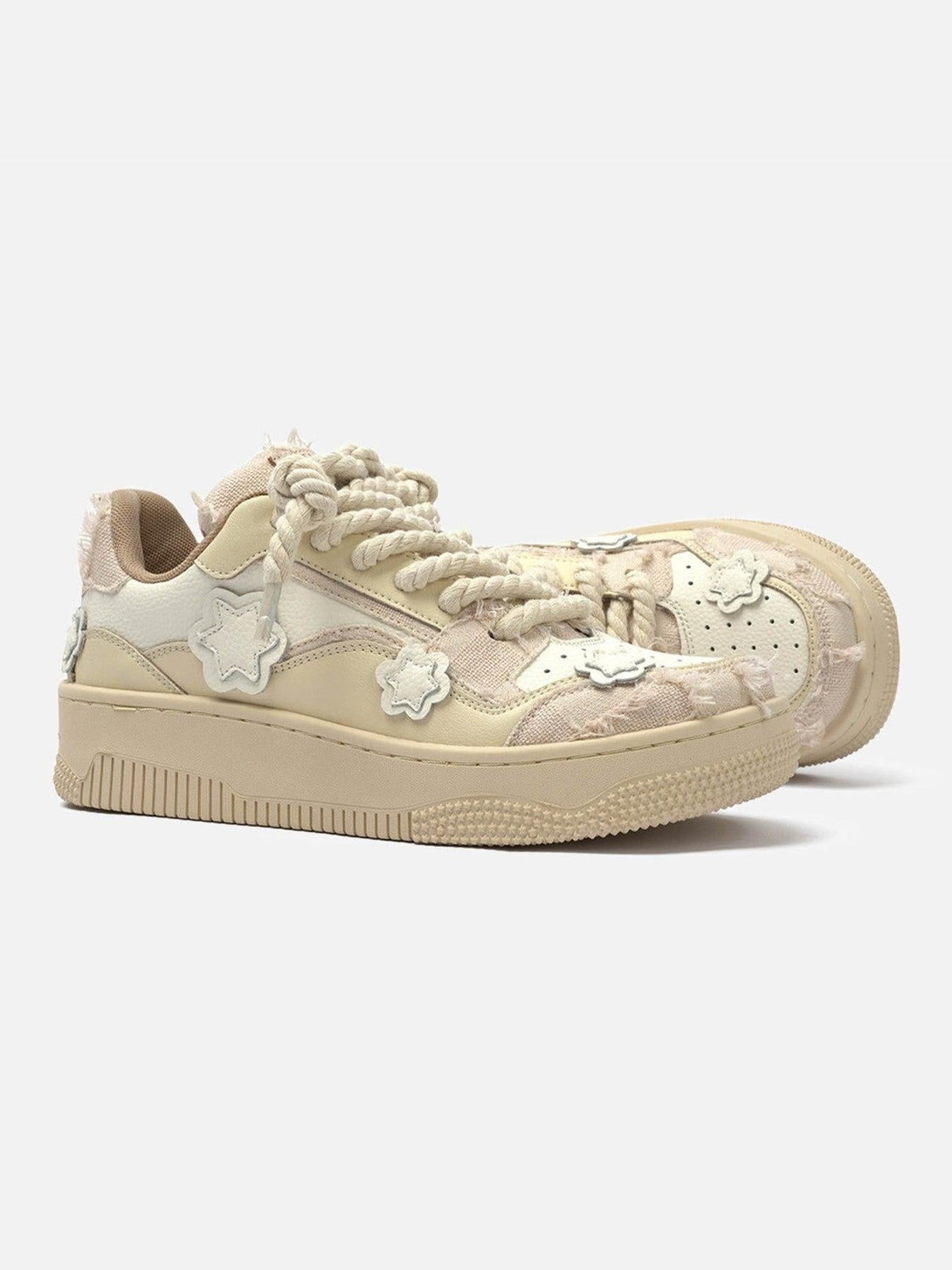 TALISHKO board shoes feature star accents and chunky twine laces for a playful style.