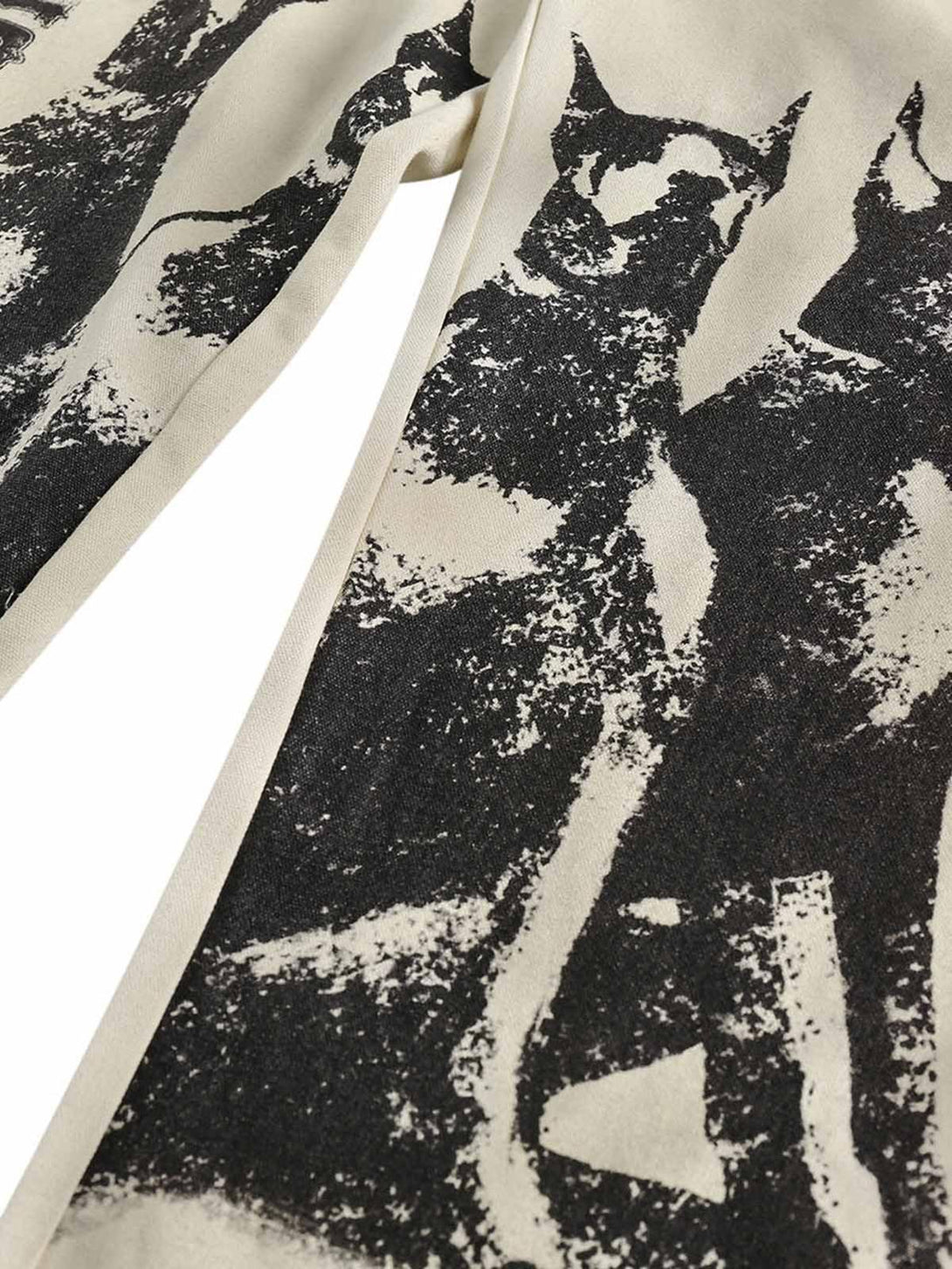 A tight crop highlighting the Doberman print on TALISHKO's wide-leg pants for an urban look.