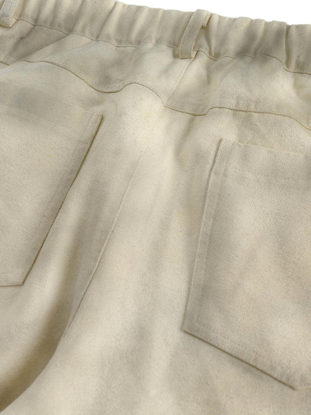 Back pockets of TALISHKO's Urban Doberman Wide-Leg Pants, highlighting casual style.