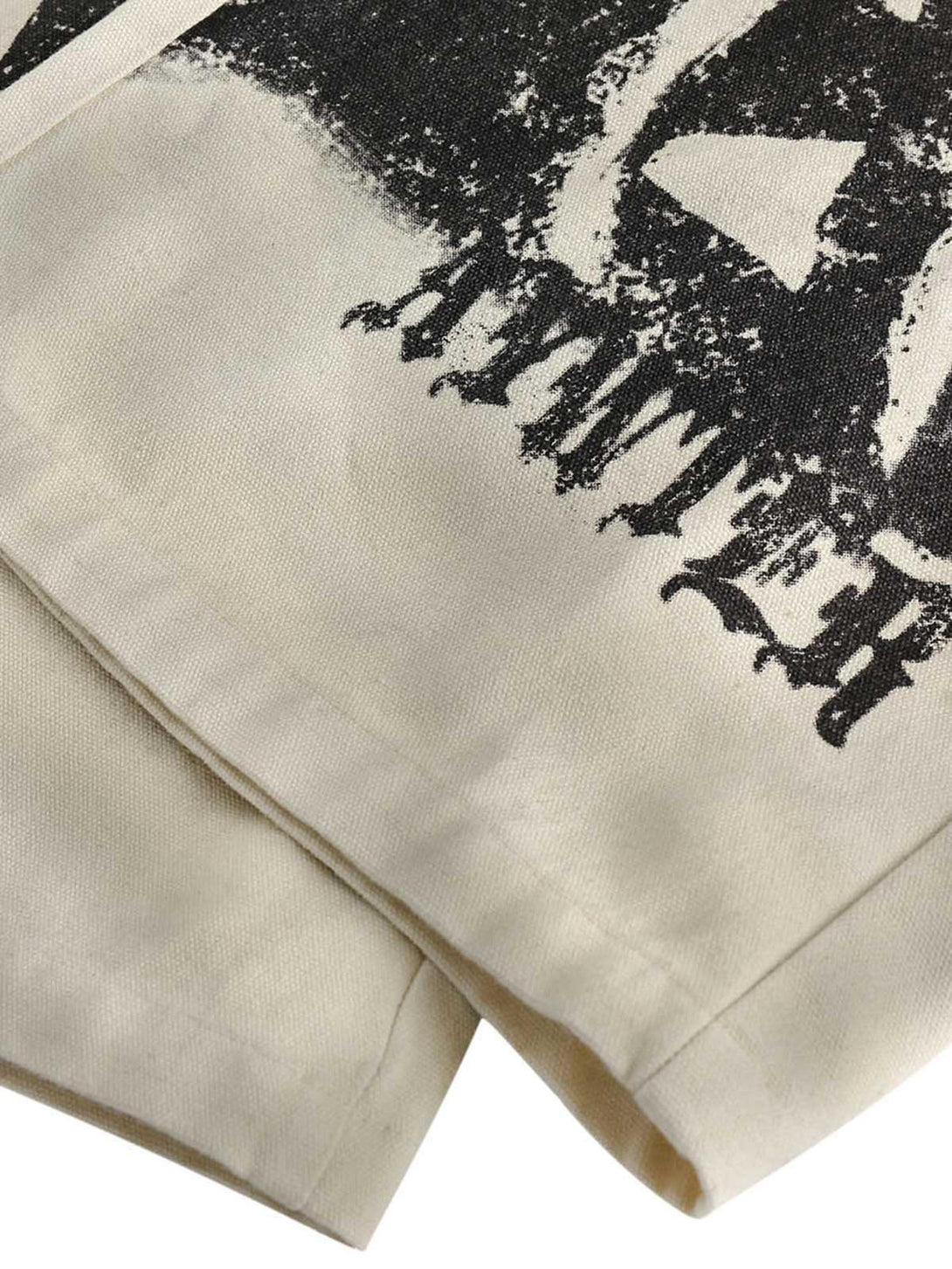 A close-up of TALISHKO's Urban Doberman Wide-Leg Pants, emphasizing the bold graphic print.