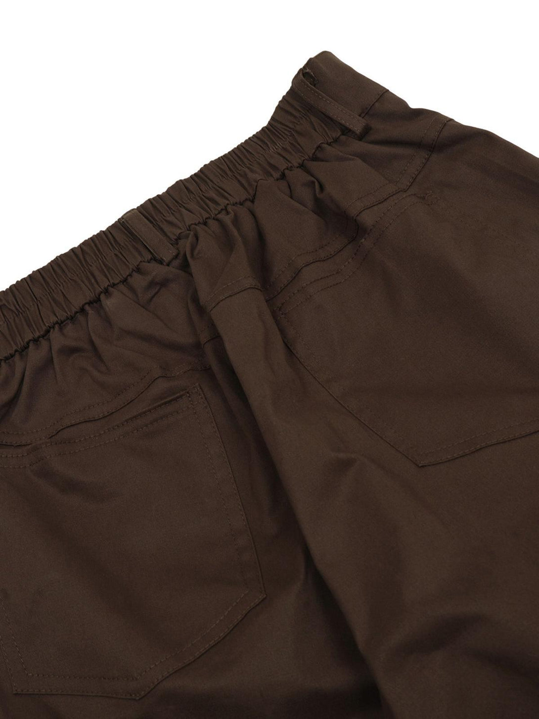 Detailed look at the brown TALISHKO Urban Explorer cargo pants' elastic waistband and pockets.