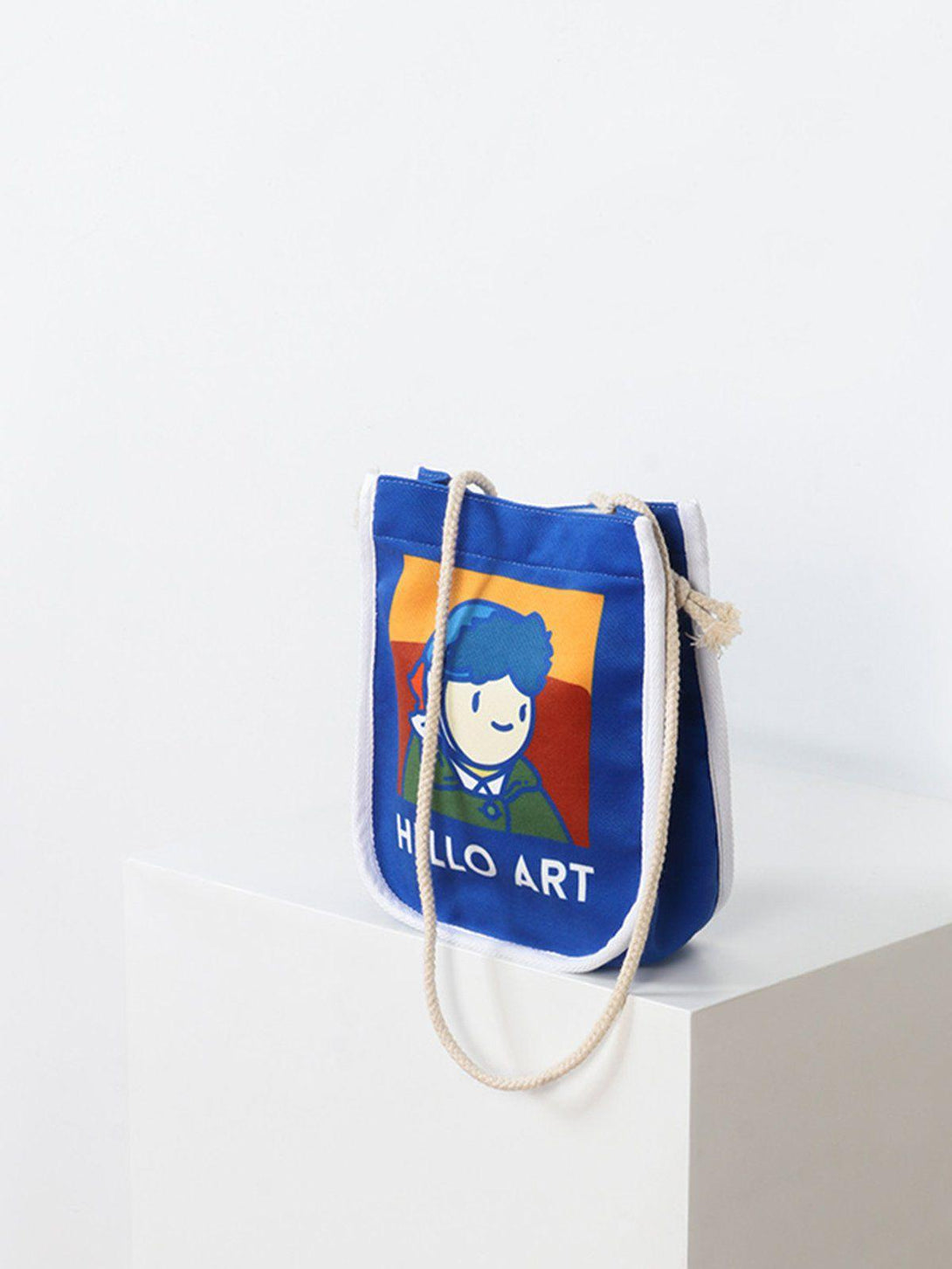 A stylish blue crossbody bag by TALISHKO featuring a playful Van Gogh cartoon design.