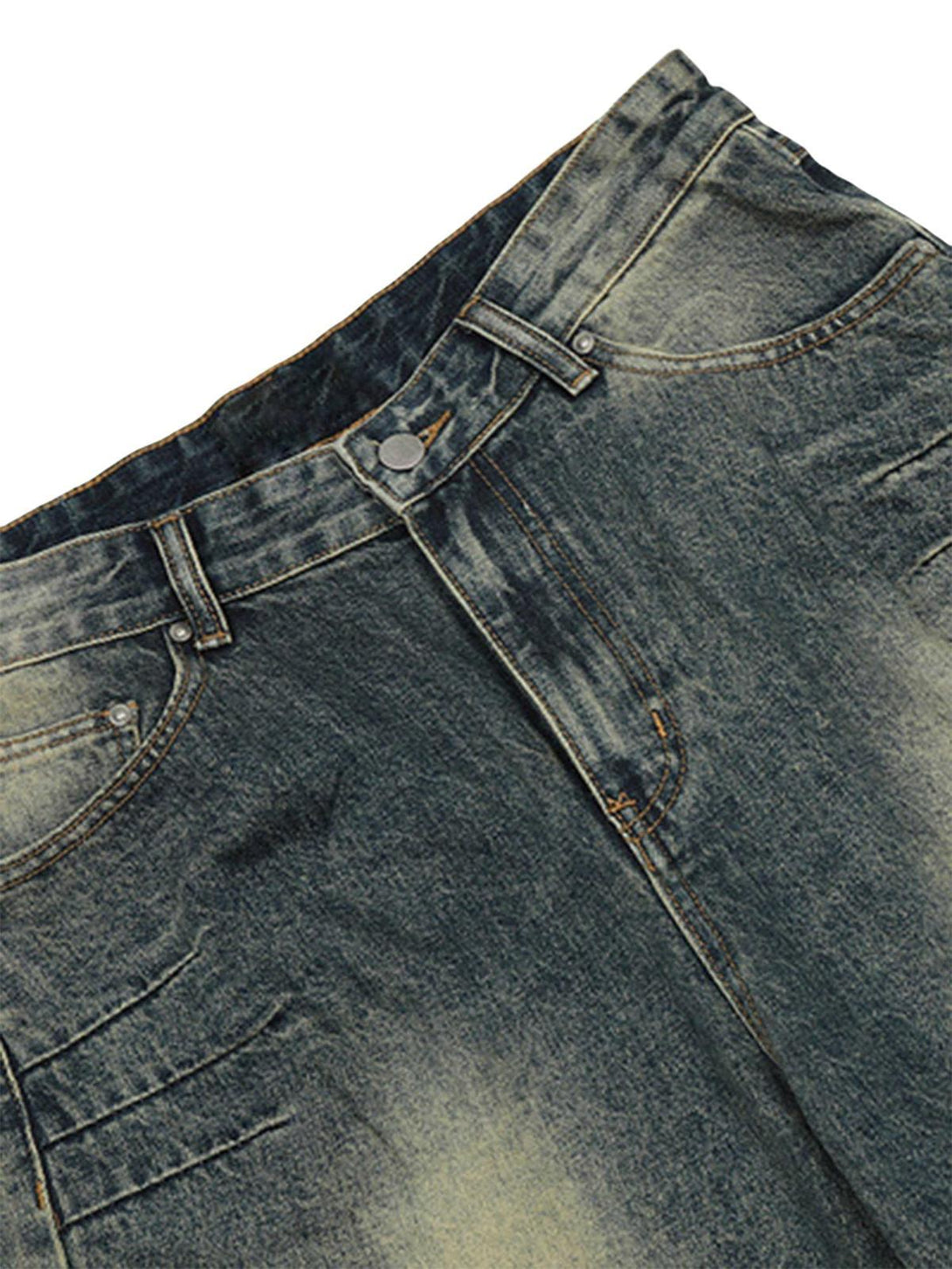 A detailed look at TALISHKO's vintage baggy jeans, highlighting unique faded denim texture.