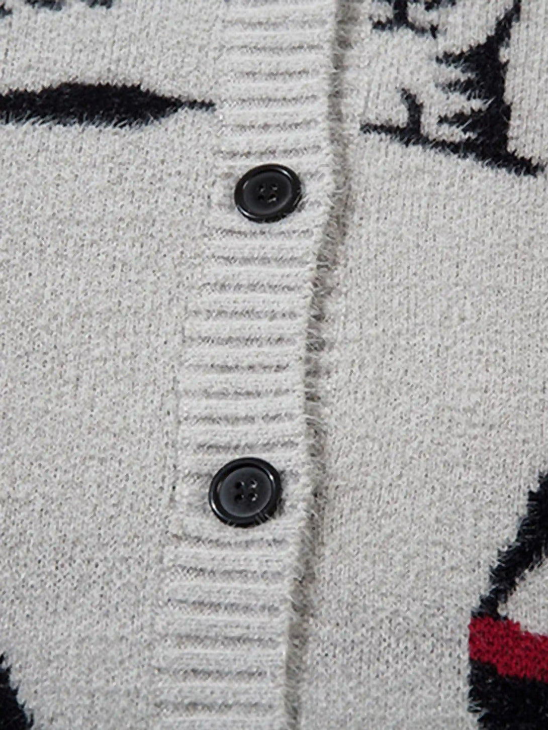 "Detailed fabric and button view on TALISHKO's vintage cat jacquard knit cardigan."