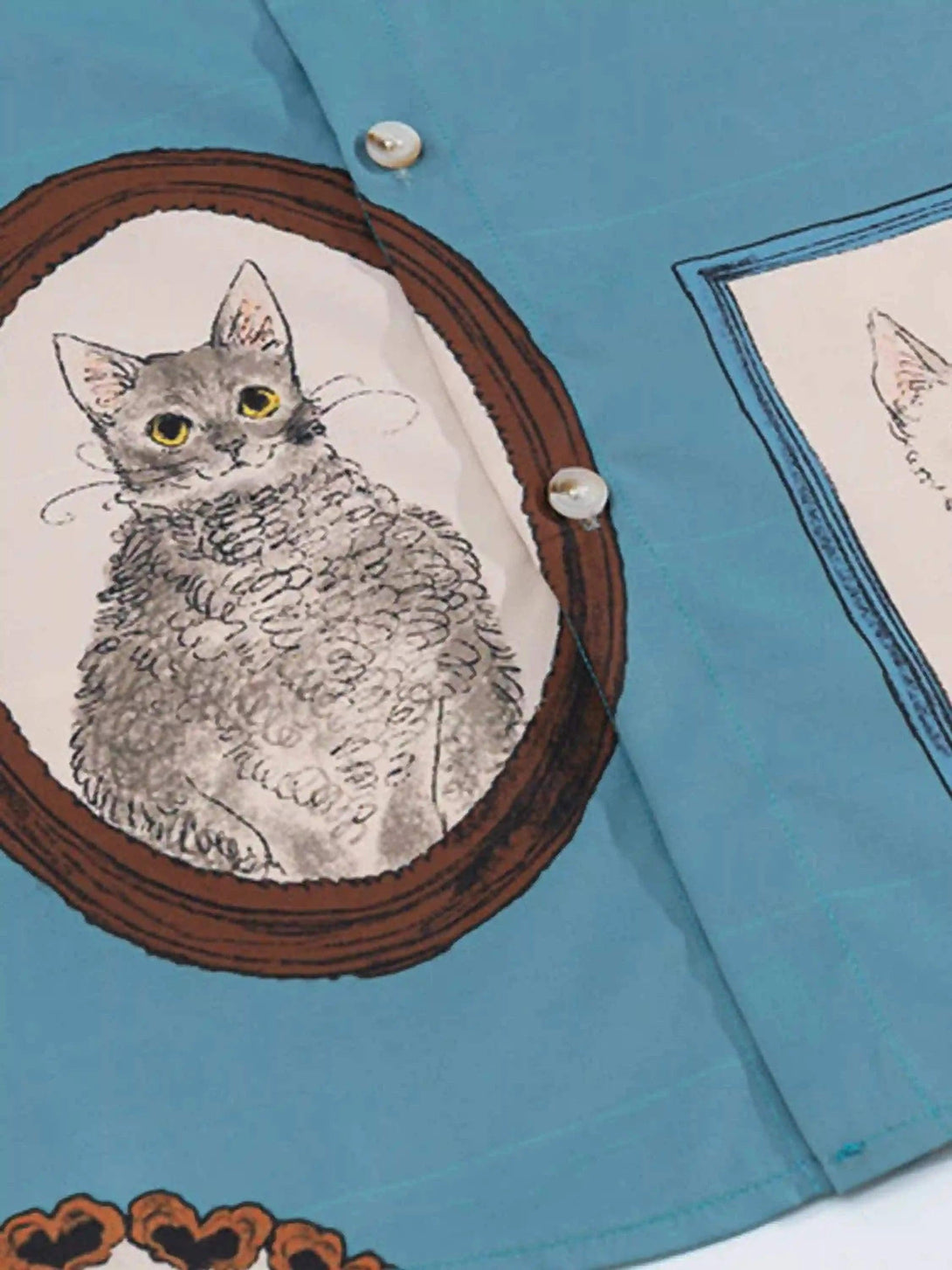 Intricate look at the vintage cat illustration on TALISHKO's short sleeve shirt, showcasing creativity.