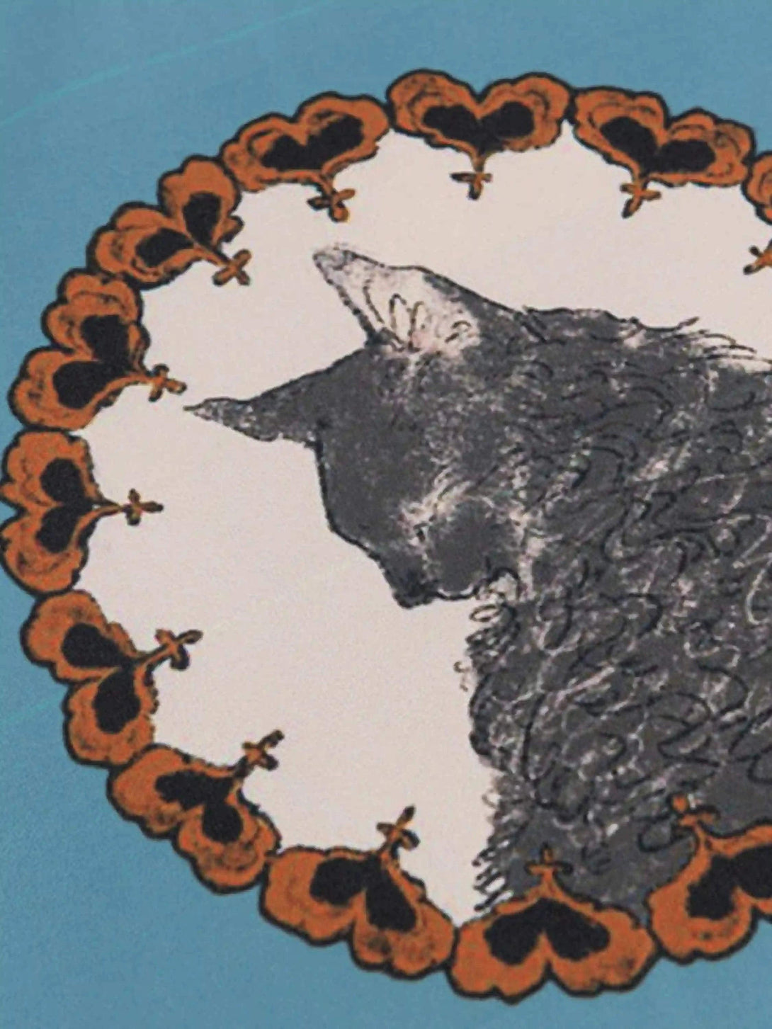 A tight crop highlighting the whimsical cat design on TALISHKO's vintage short sleeve shirt.