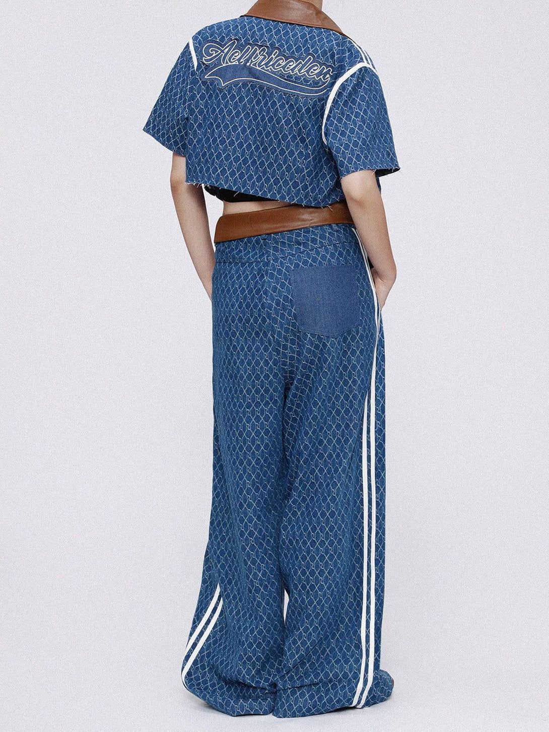Back view of TALISHKO vintage denim jacquard set with brown leather accents and unique pattern.