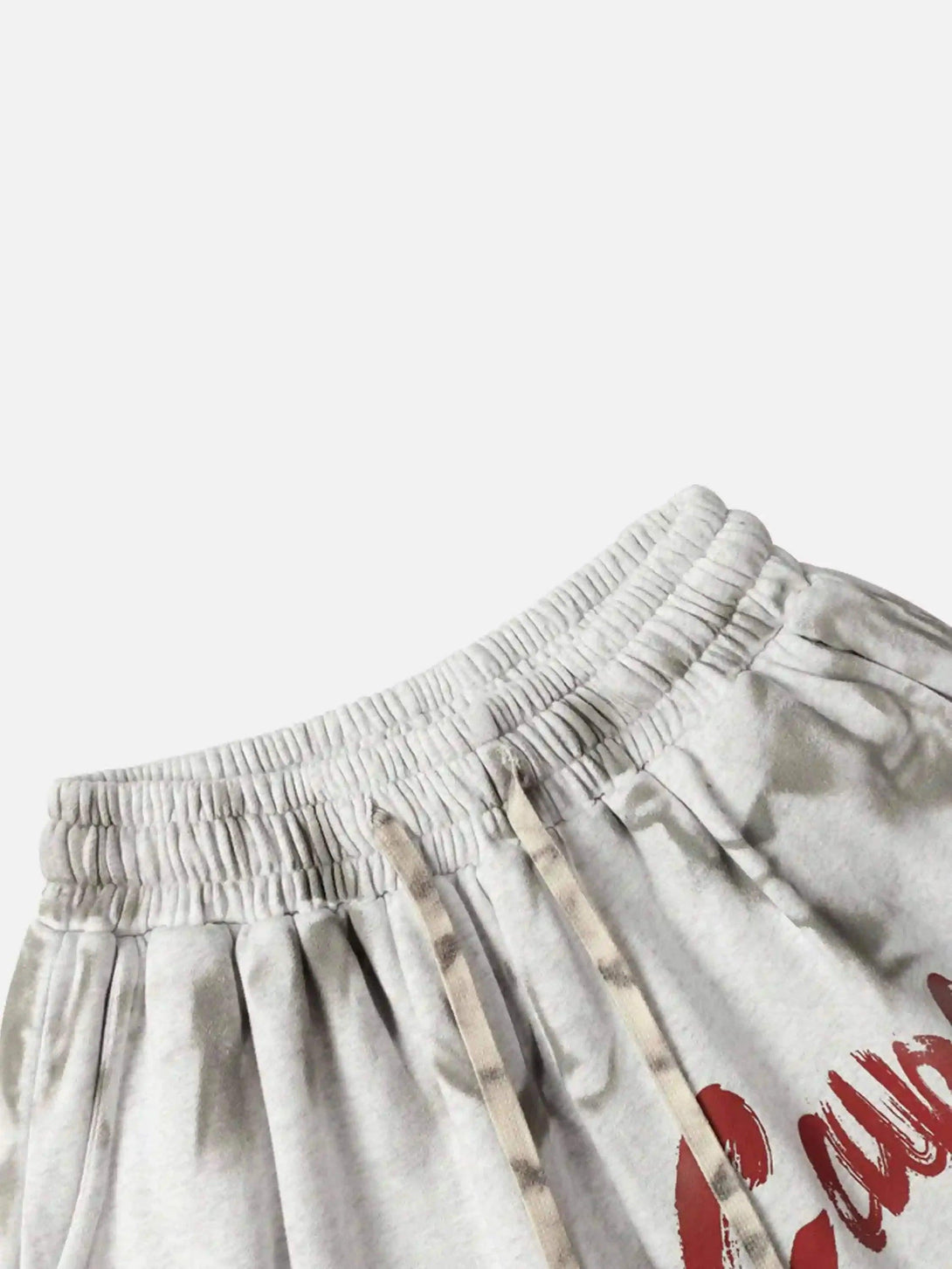 A detailed look at TALISHKO's vintage-style gray shorts with elastic waistband and drawstring.