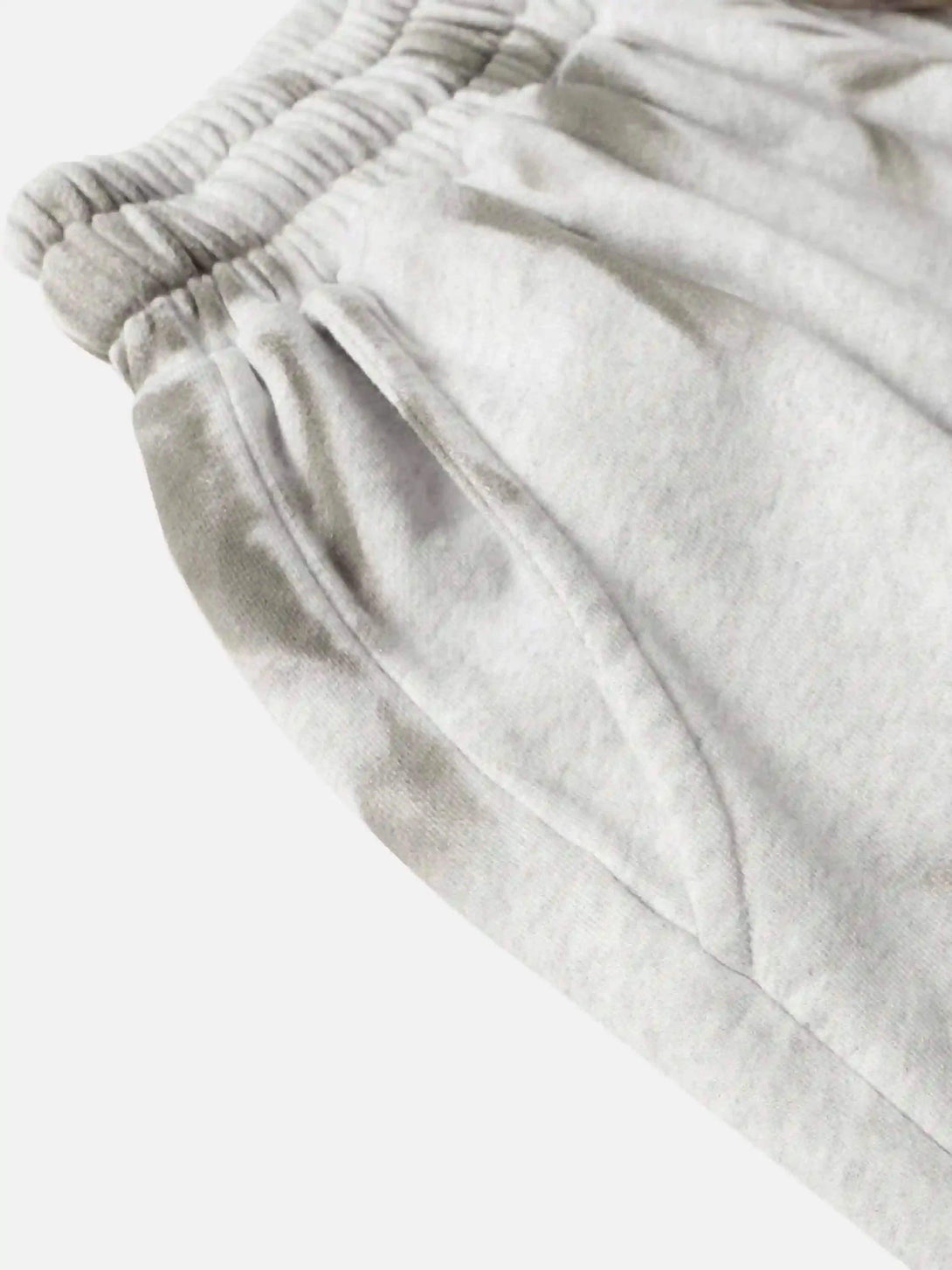 A close-up view of TALISHKO's vintage-style loose shorts featuring an elastic waistband.
