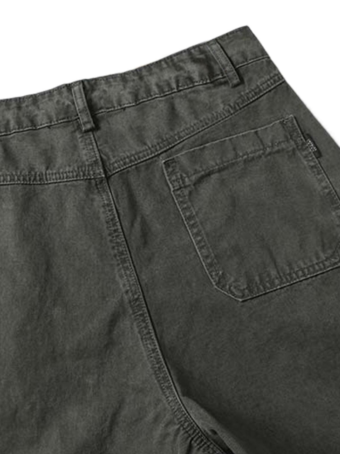 Intricate look at TALISHKO's vintage distressed cargo pants, highlighting back pocket detail.