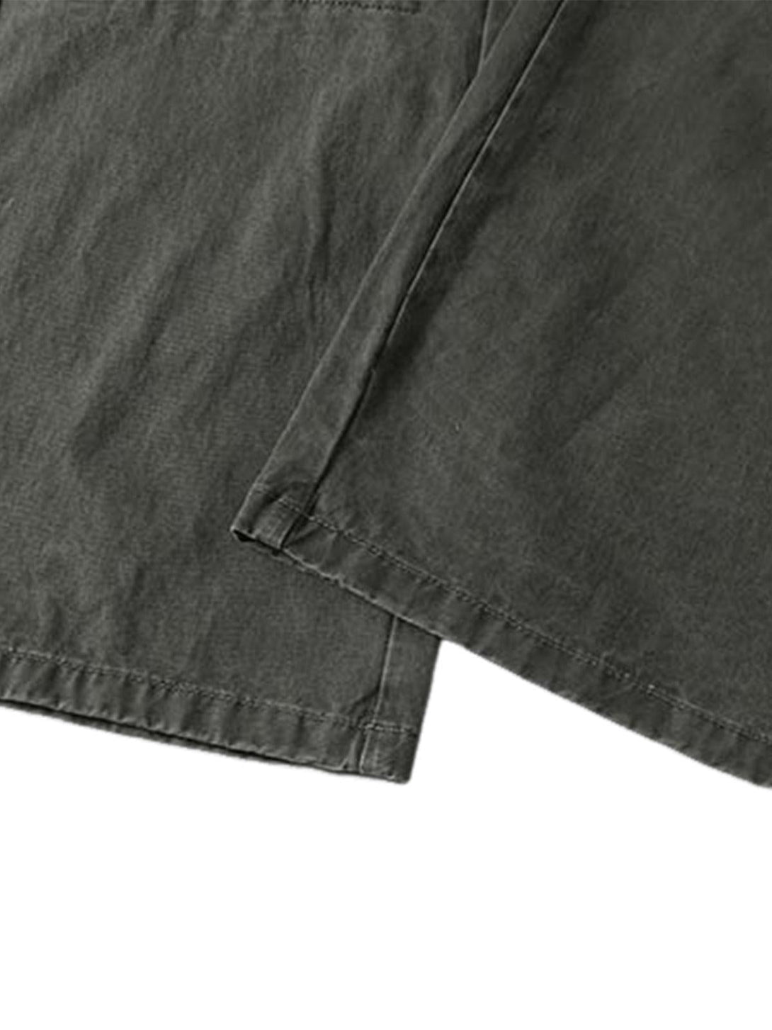TALISHKO's vintage distressed cargo pants, with an up-close view of fabric and stitching.