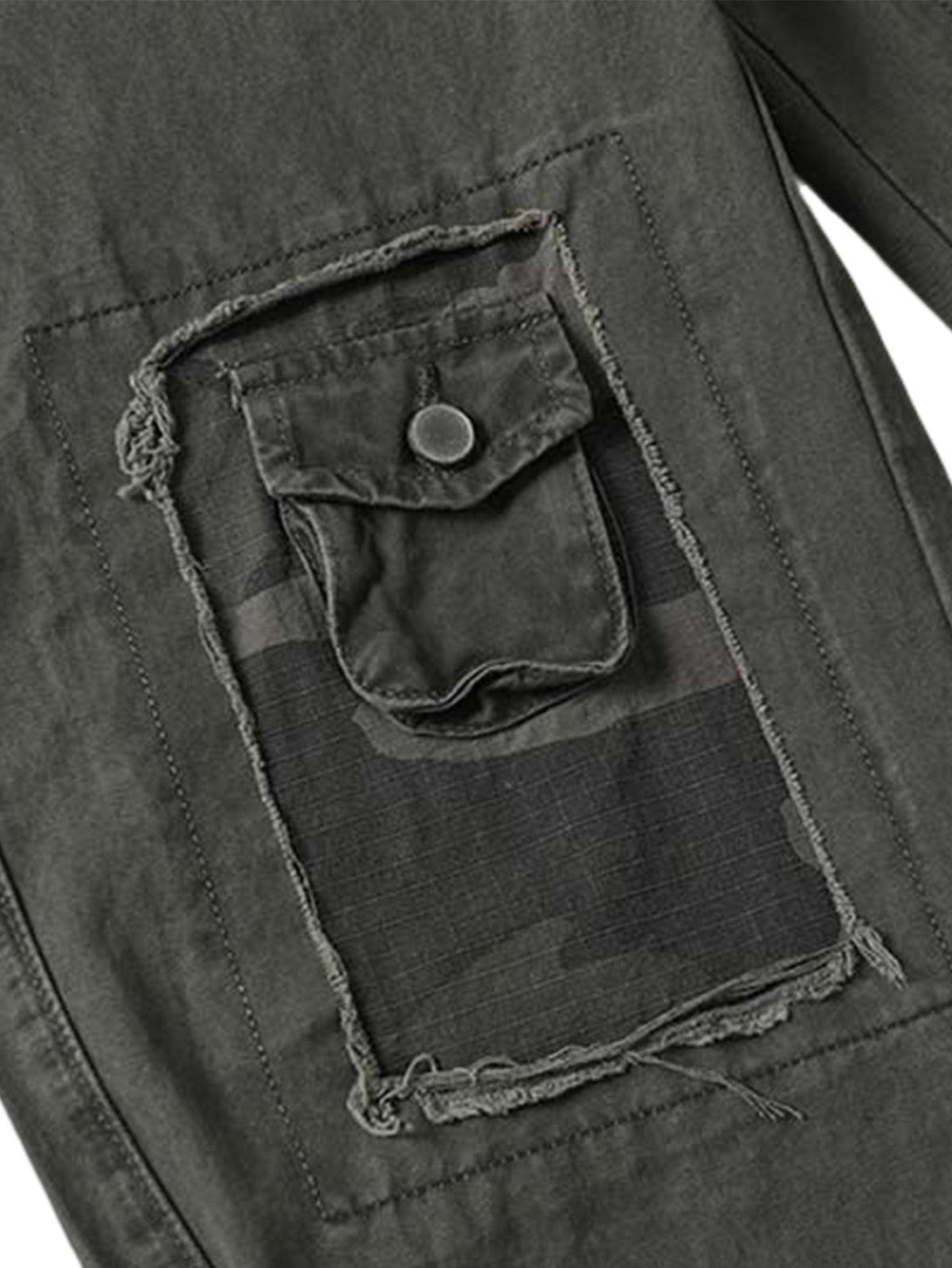 Detailed fabric and stitching on TALISHKO's vintage distressed cargo pants, showcasing unique pocket design.