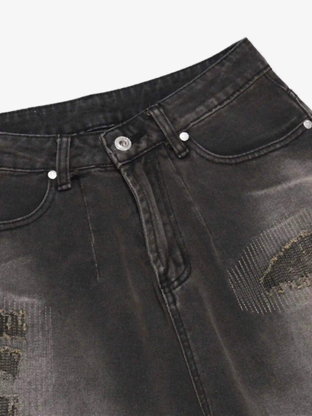 A detailed look at TALISHKO vintage distressed denim shorts, highlighting the gradient design.
