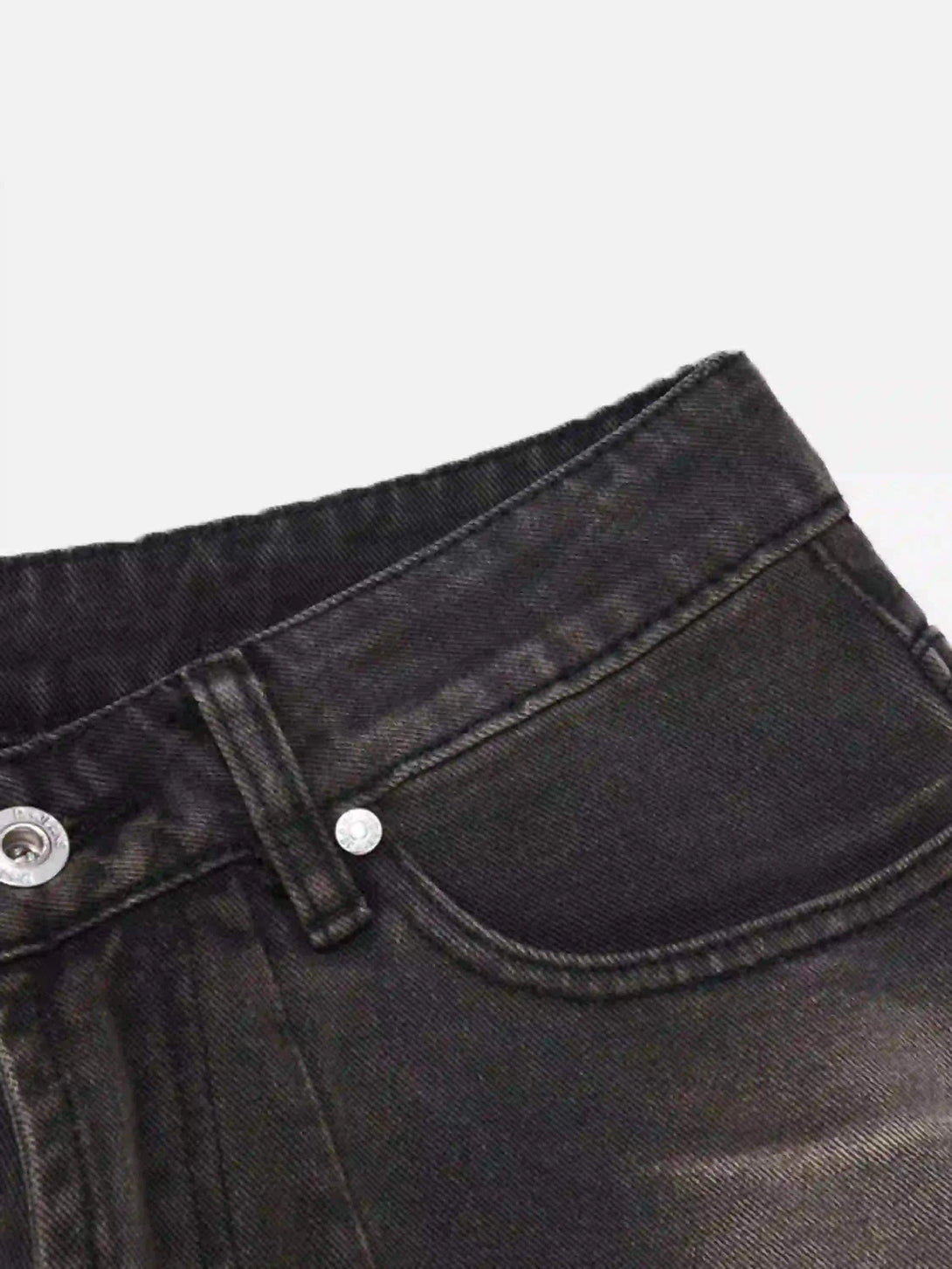 A close-up view of TALISHKO's vintage denim shorts highlighting the intricate pocket stitching.