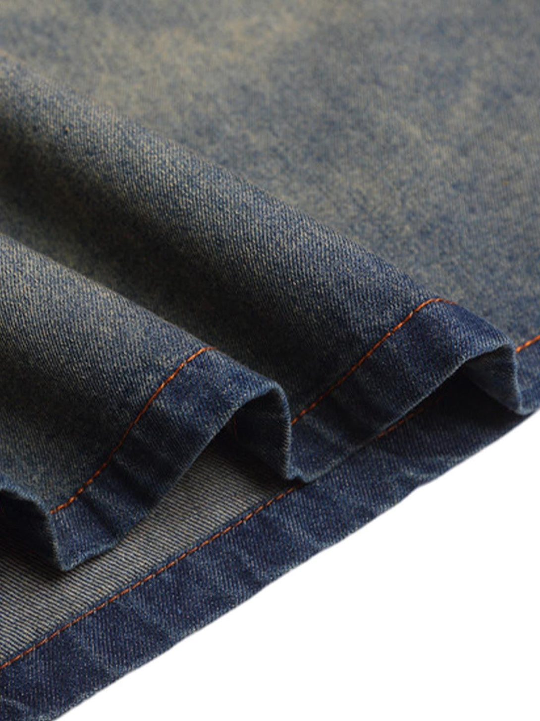 "Intricate look at TALISHKO denim T-shirt fabric, showcasing gradient wash and stitching."