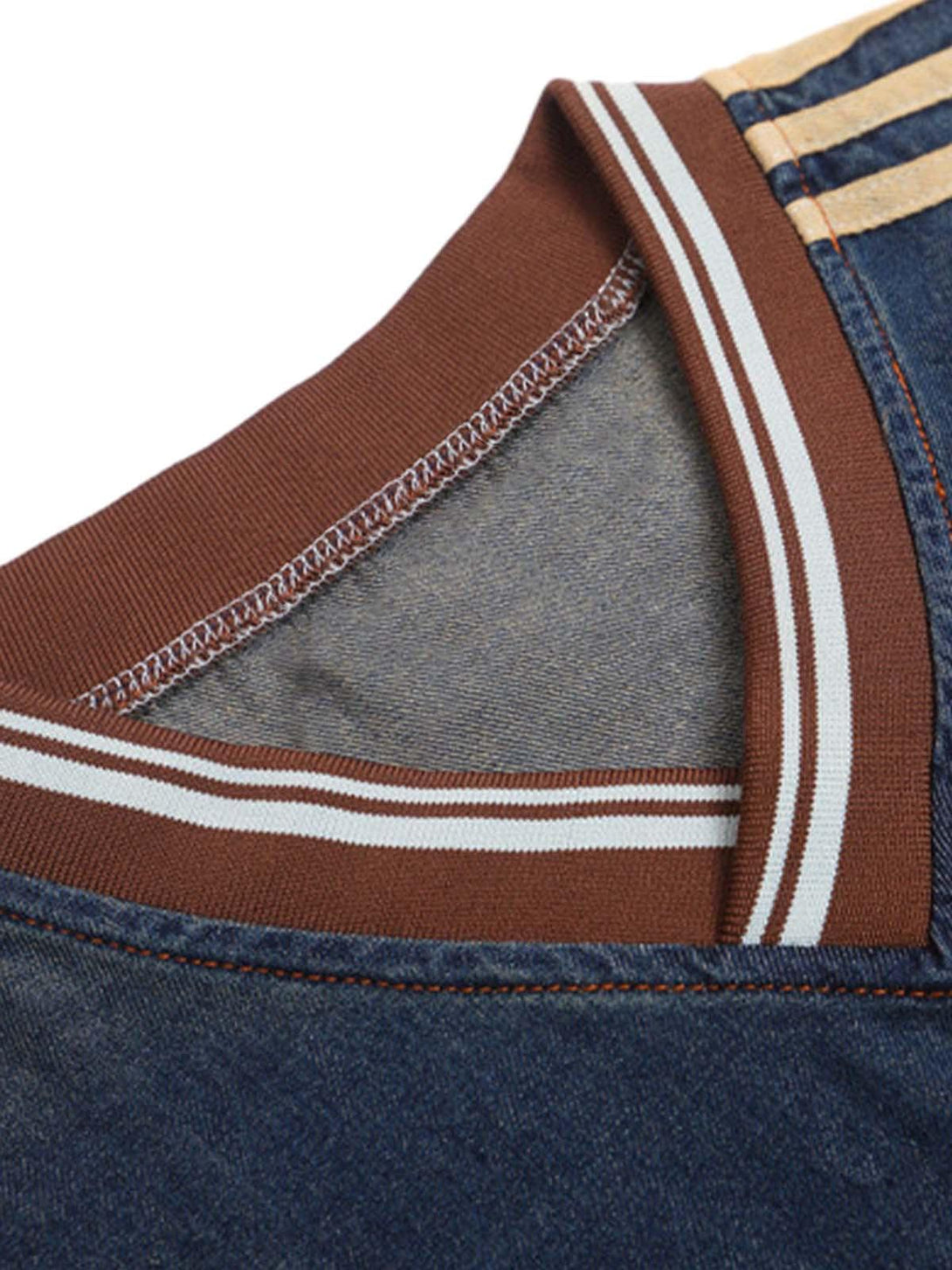 A detailed look at the TALISHKO vintage denim T-shirt's striped collar and stitching.