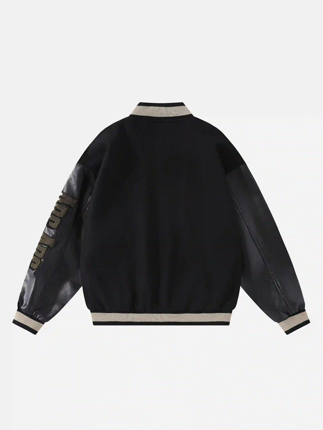 Back view of a black vintage baseball jacket by TALISHKO, featuring embroidered sleeves.