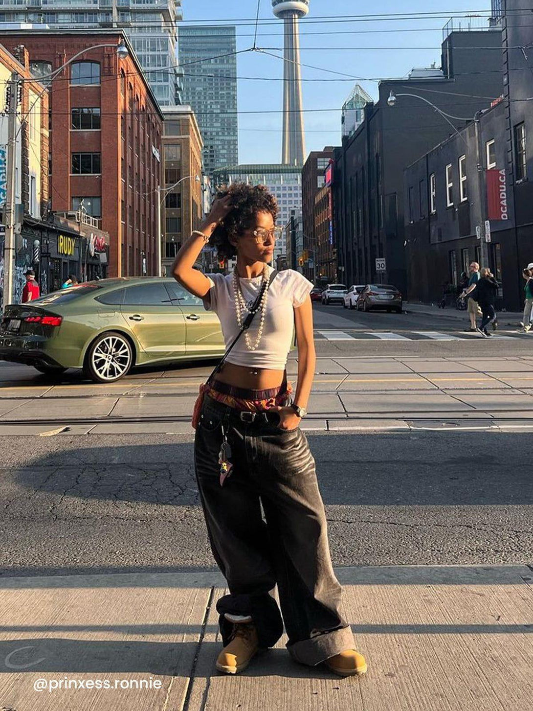Street style with vintage folds loose jeans by TALISHKO, worn casually in an urban setting.