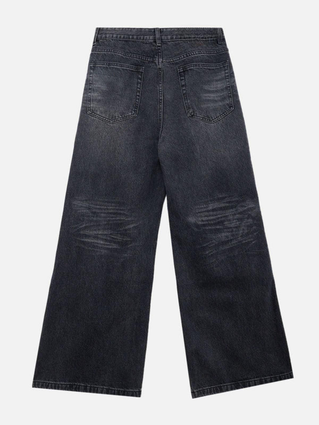 Back view of TALISHKO vintage folds loose jeans in black, emphasizing a relaxed fit.