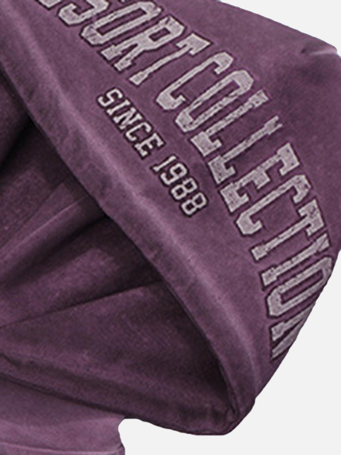 The TALISHKO sweatshirt features a close-up of the hood's vintage lettering design.