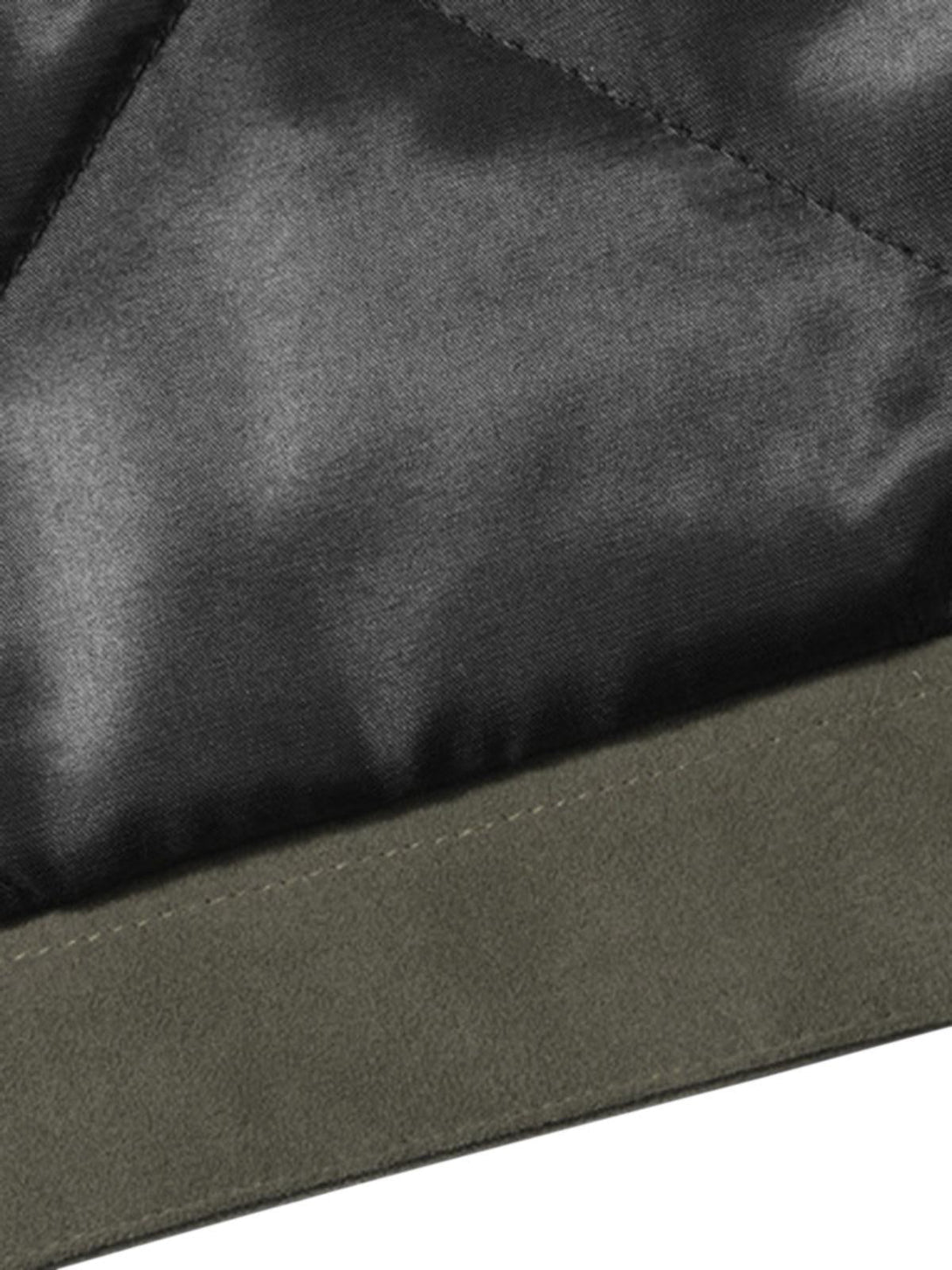 Intricate look at TALISHKO's quilted suede jacket texture and stitching detail.