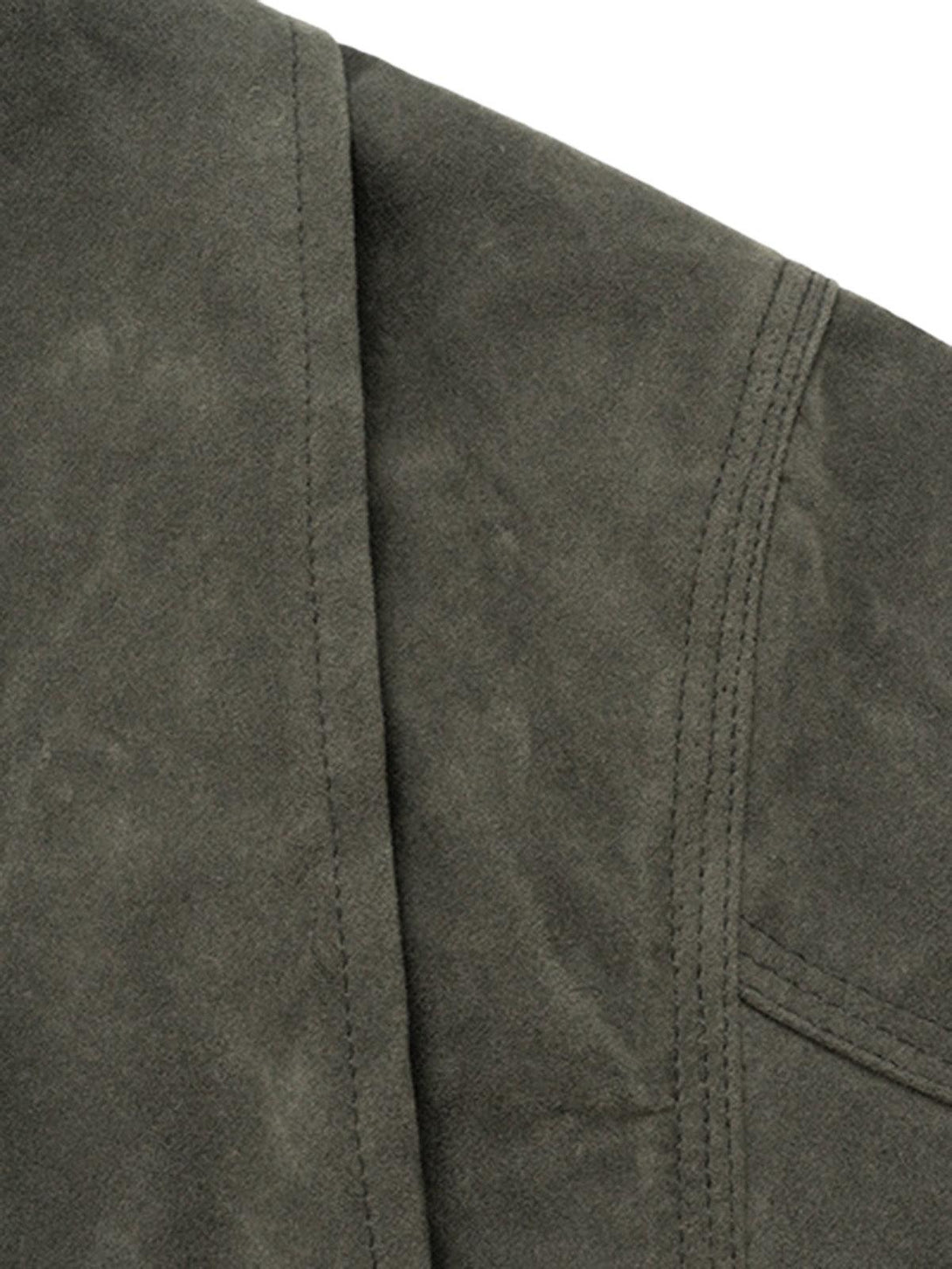 Intricate look at TALISHKO's vintage suede jacket, showcasing detailed stitching and texture.