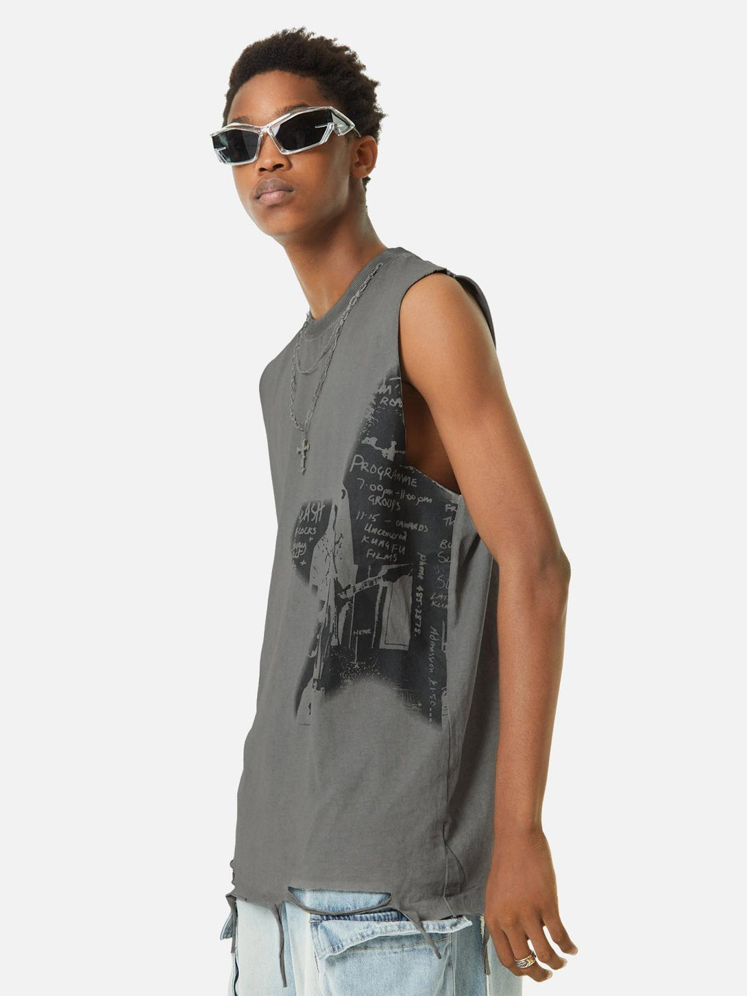 Model showcasing TALISHKO tank top with vintage print, styled with sunglasses and layered necklaces.