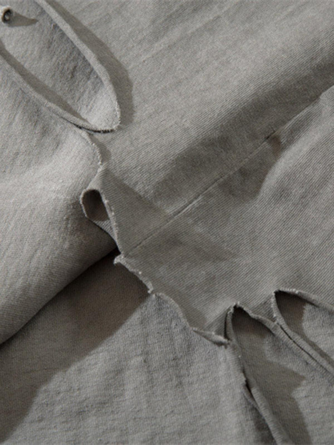 Detailed fabric and stitching of TALISHKO's hip-hop tank top showcasing vintage style.
